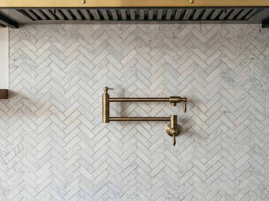 Tile Work - kitchen backsplash in East Village brownstone, marble subway tile herringbone