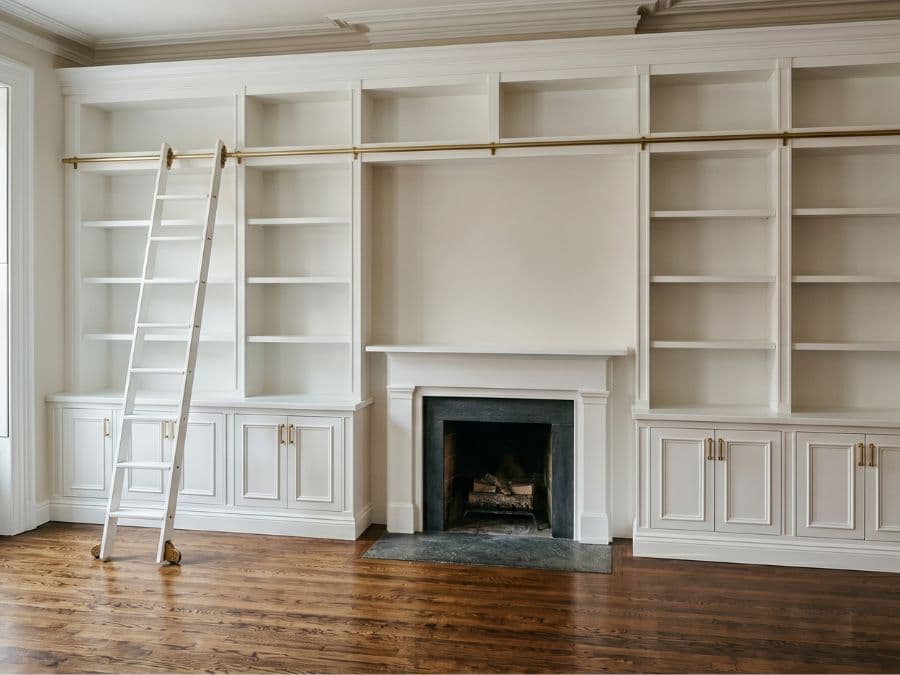 Carpentry - custom built-in bookshelves in East Village brownstone, painted white